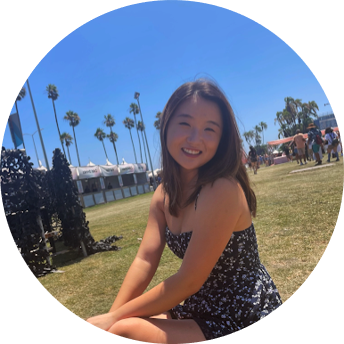 A student sitting on the grass