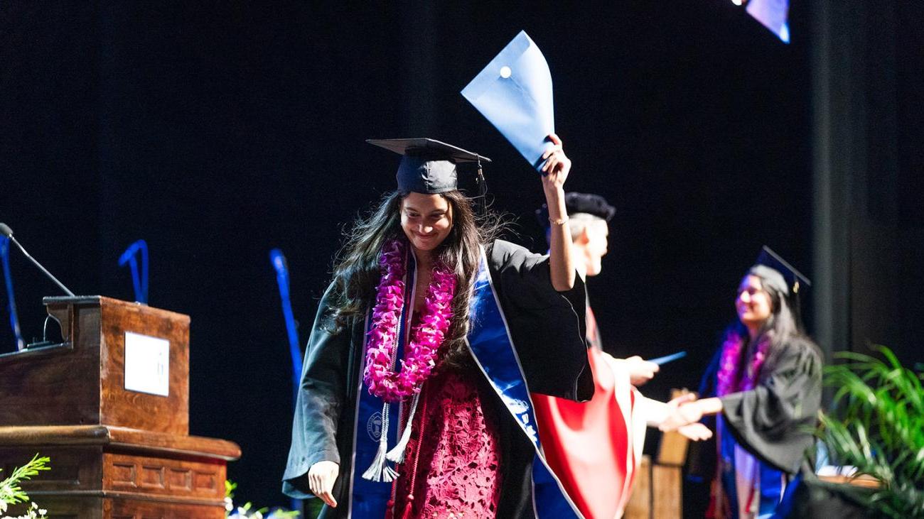 Commencement 2024 students receiving their degrees