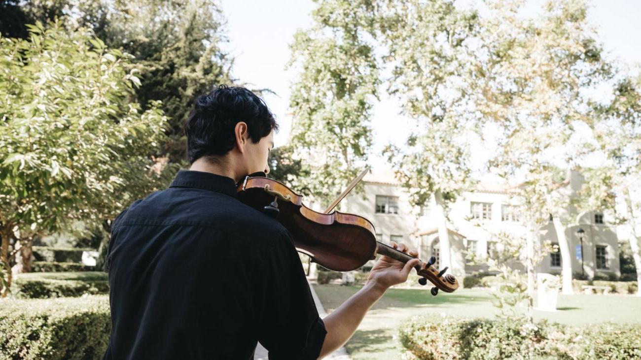 Pomona student playing instrument